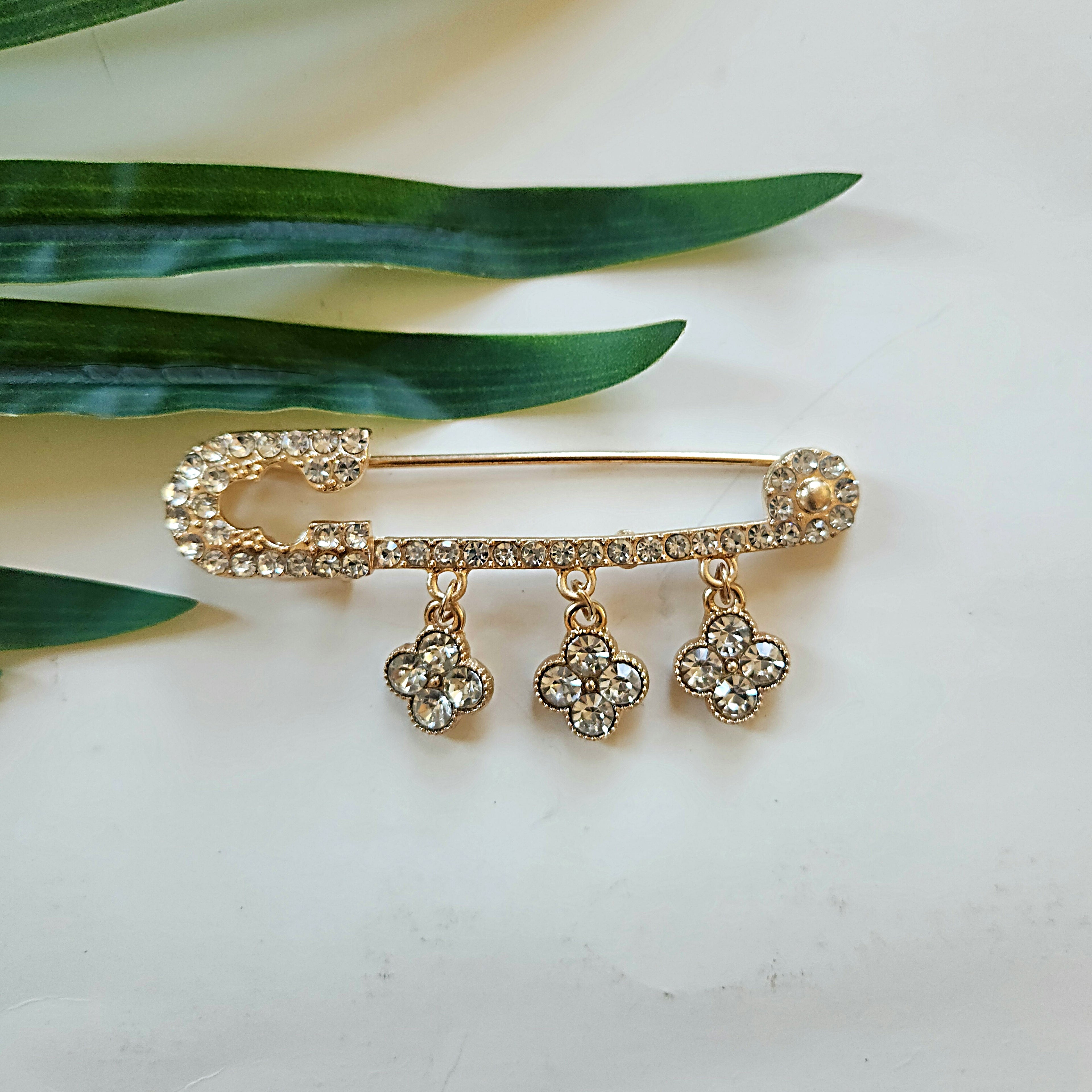 Vedazzling Gold Pinned Brooch